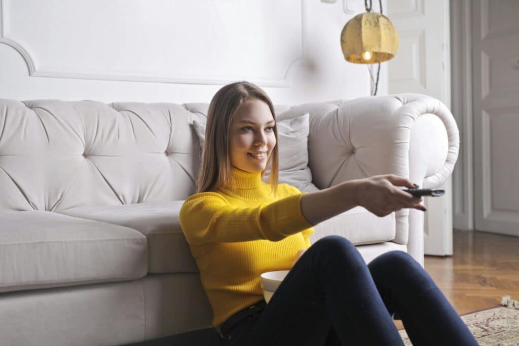 Photo by Andrea Piacquadio: https://www.pexels.com/photo/happy-young-relaxed-woman-watching-tv-at-home-3768898/