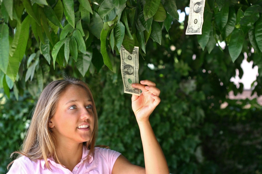 woman-plucking-dollar-bills-out-of-trees