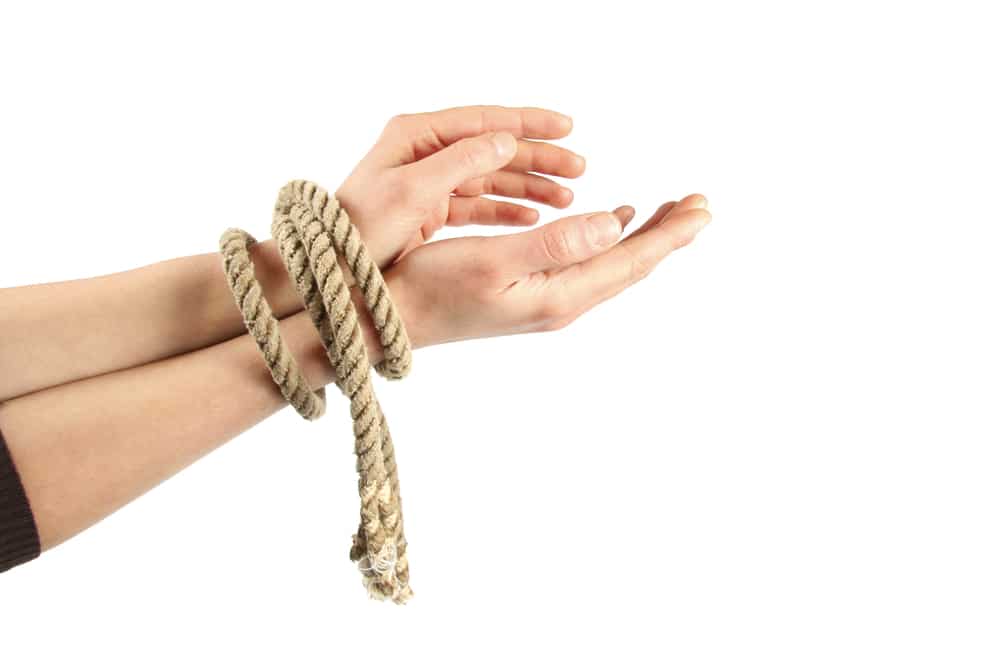 two-hands-with-ropes-tied-together