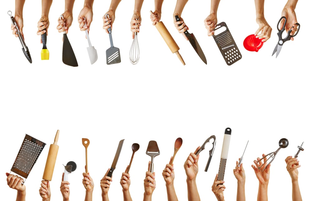 hands-holding-kitchen-tools
