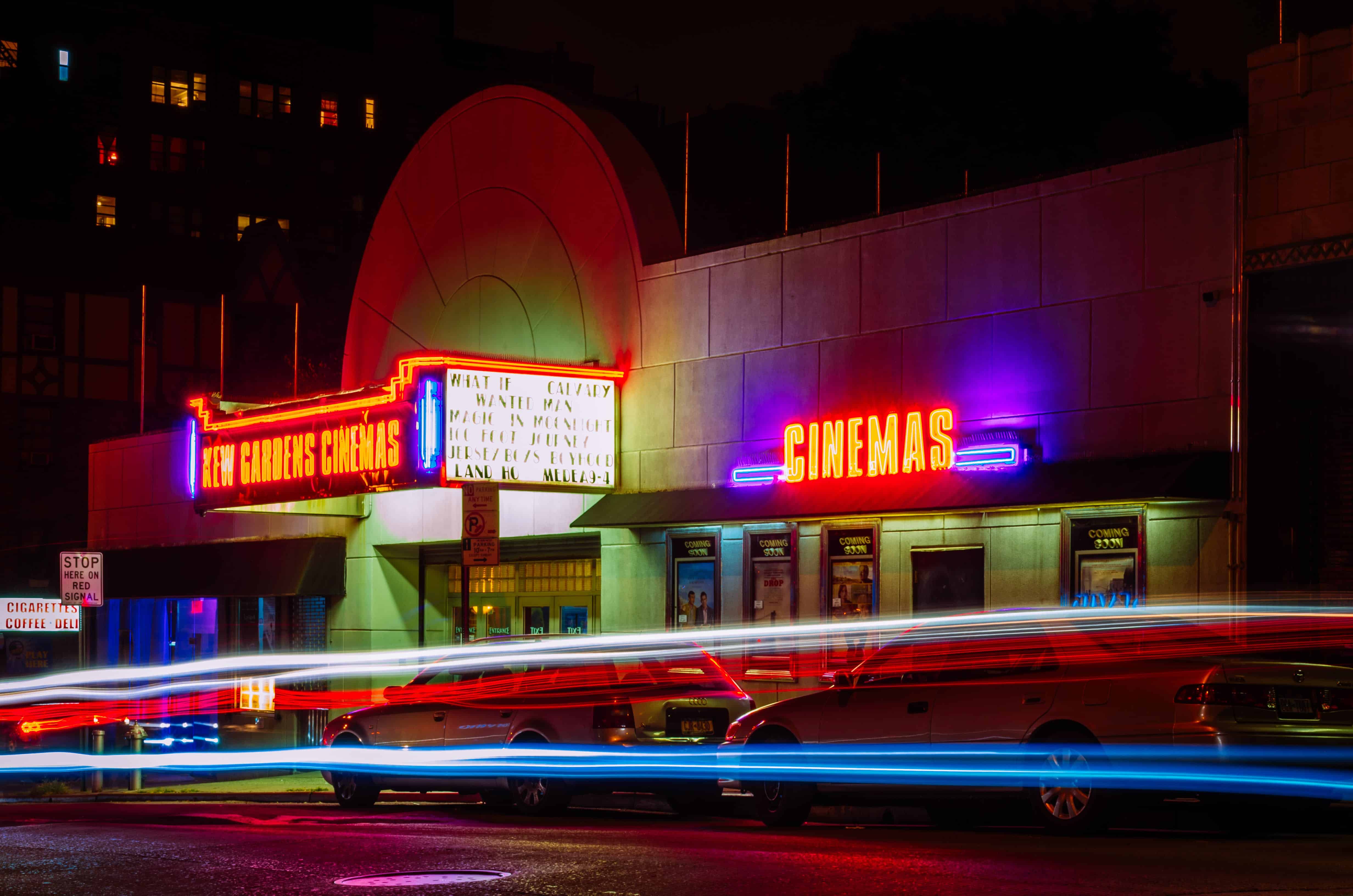 A neon-lit cinema at night