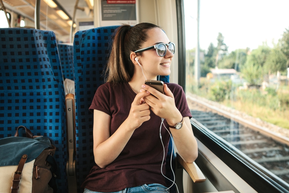 girl in train traveling abroad