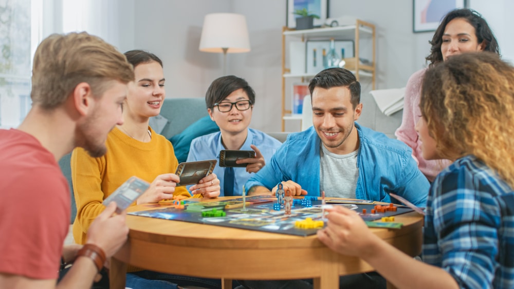 group of friends immersing in english with board games