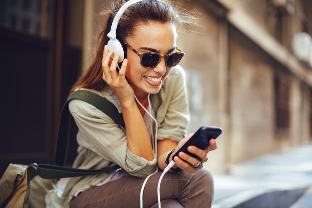 young woman listening to headphones