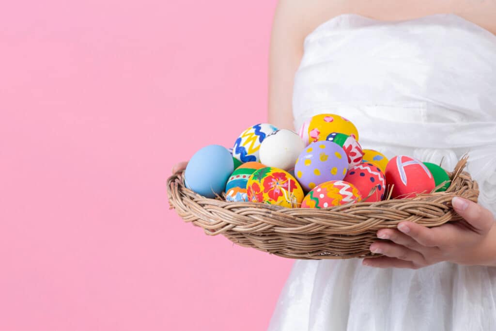 Woman Holding a Basket of Easter Eggs