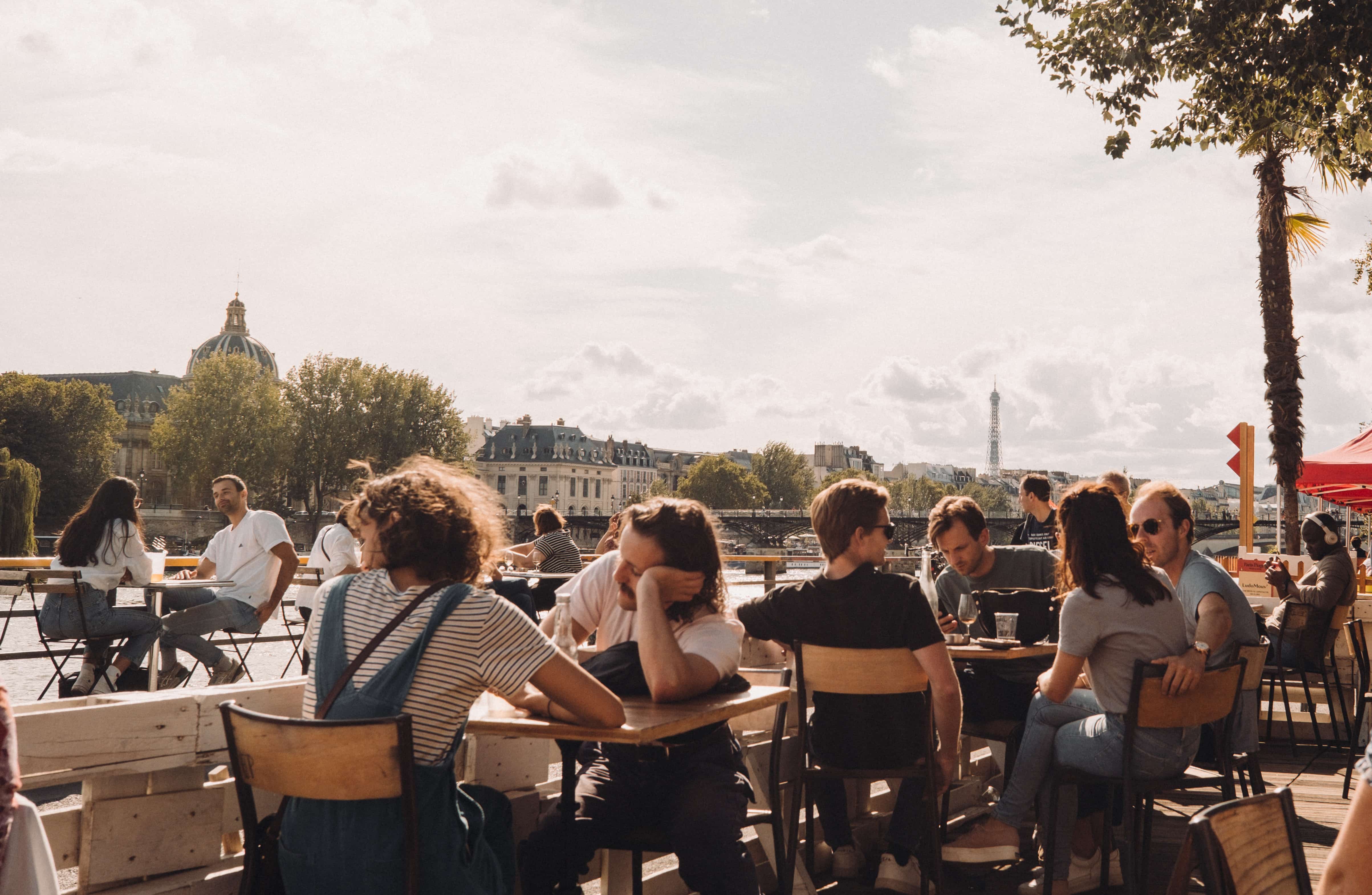 People dining beside the river in Paris