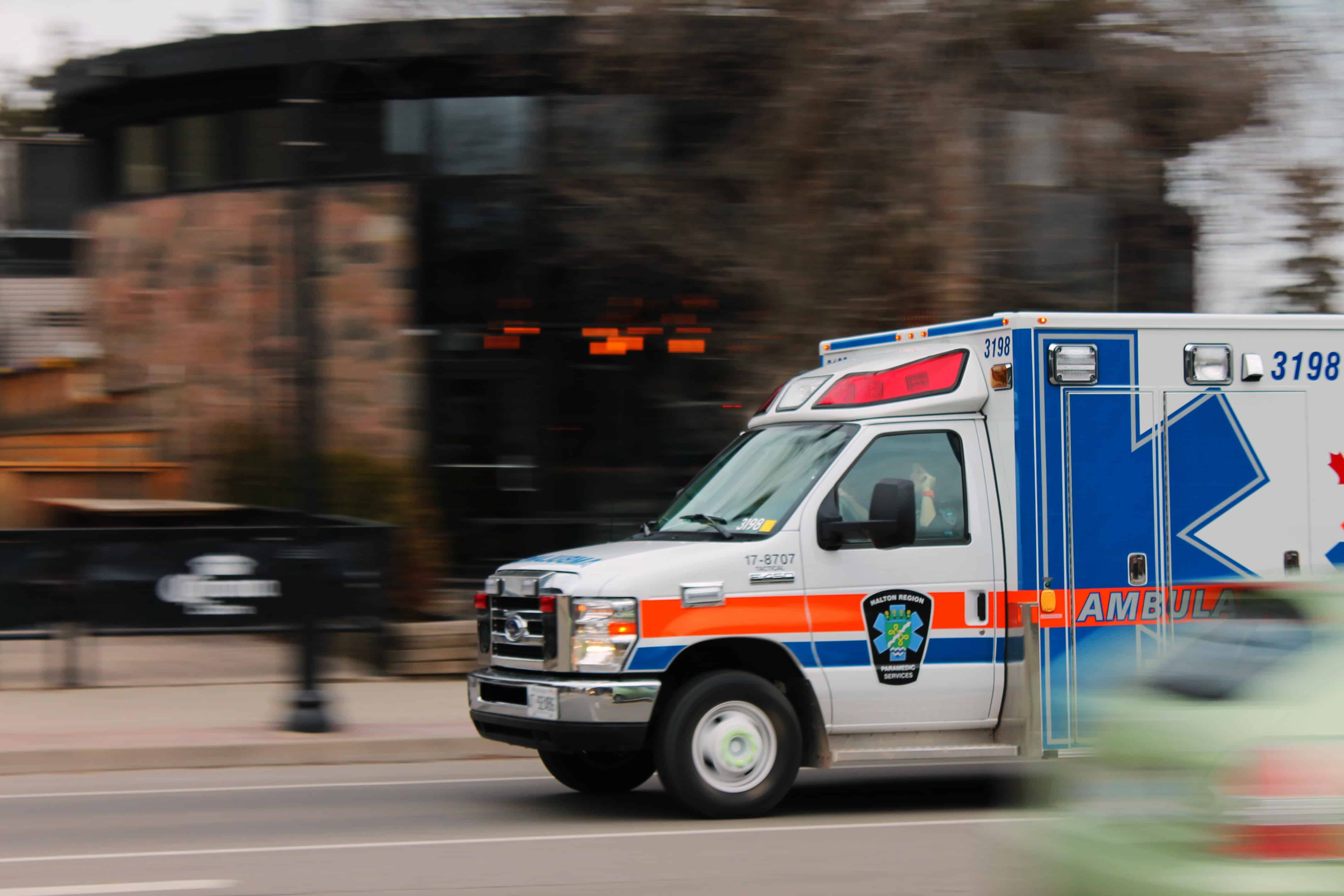 ambulance driving down the road