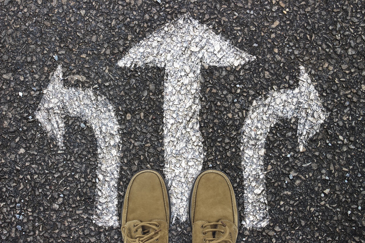 shoes-on-three-white-arrows-pointing-left-center-and-right
