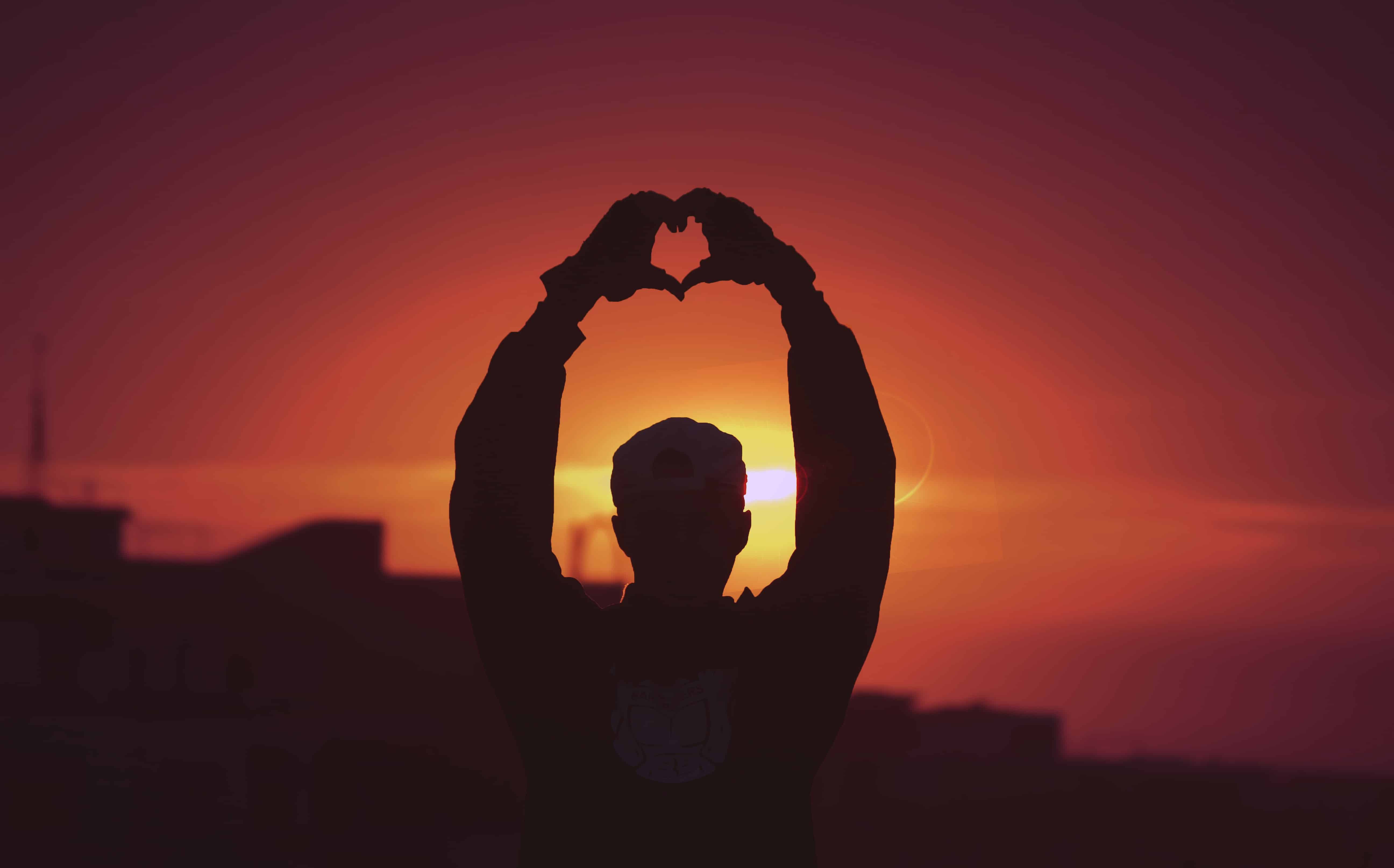 A man making a heart with his hands