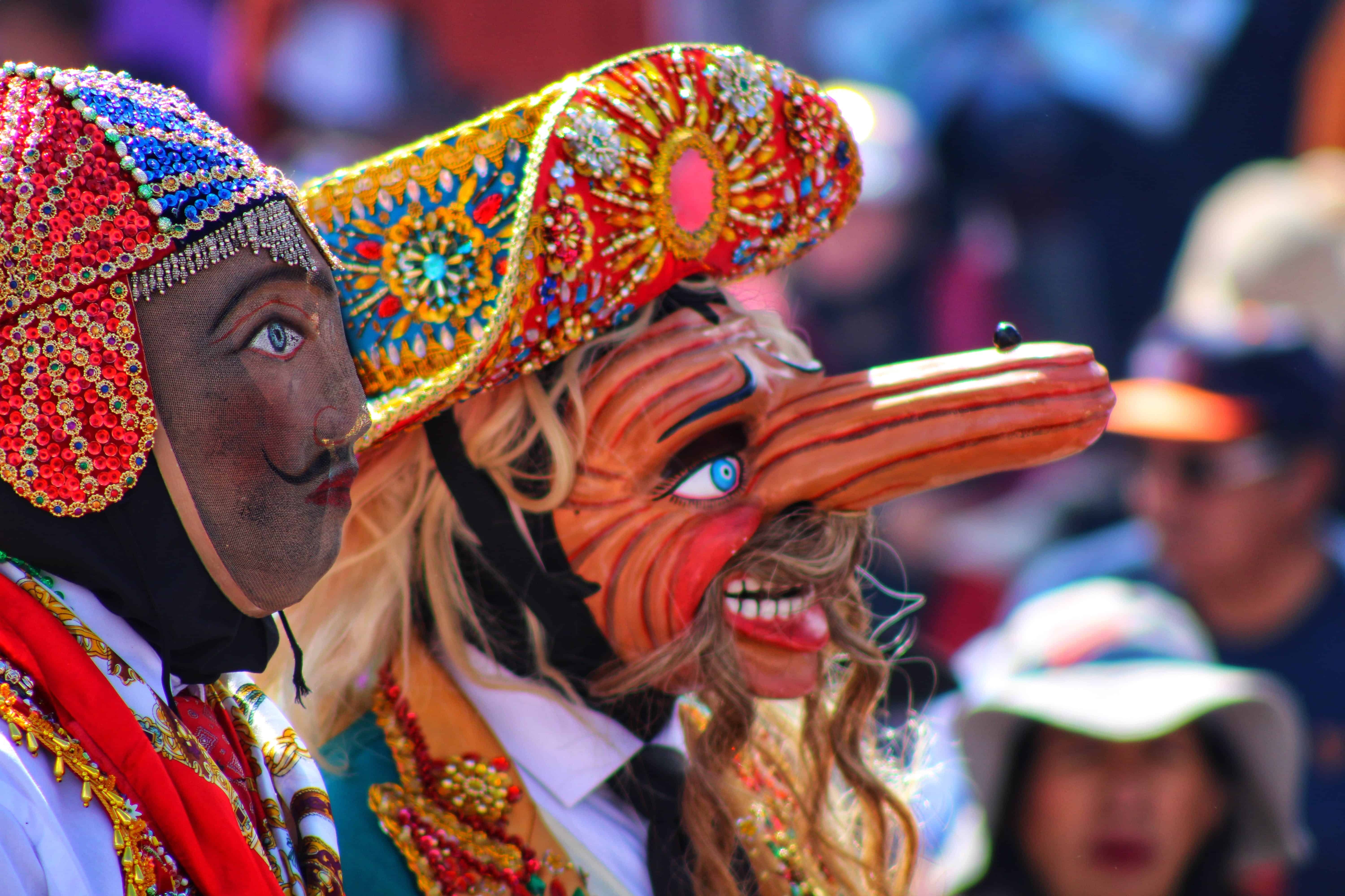 People dancing with indigenous masks in Guatemala