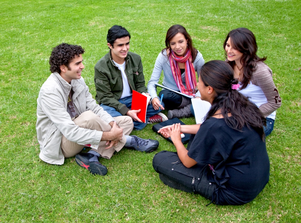 Group-of-students-sitting-in-a-circle-outdoors