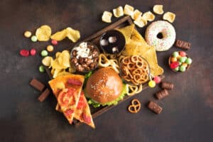 food board with pizza, burgers, bagels, pretzels and other snacks