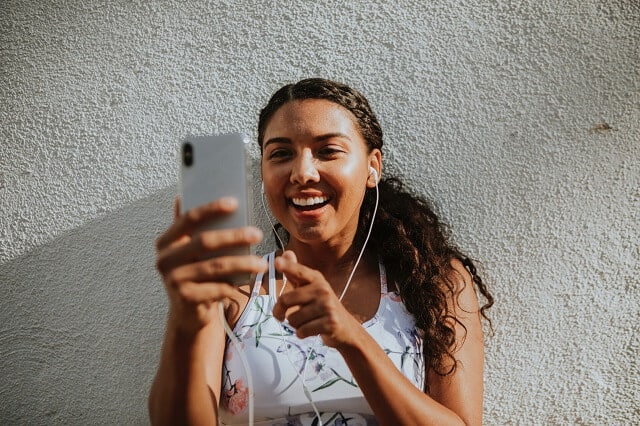 Woman listening to music on her phone