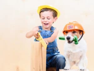 kid and dog with tools