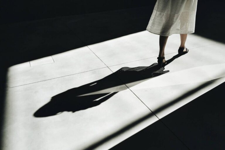 shadow of a woman walking away