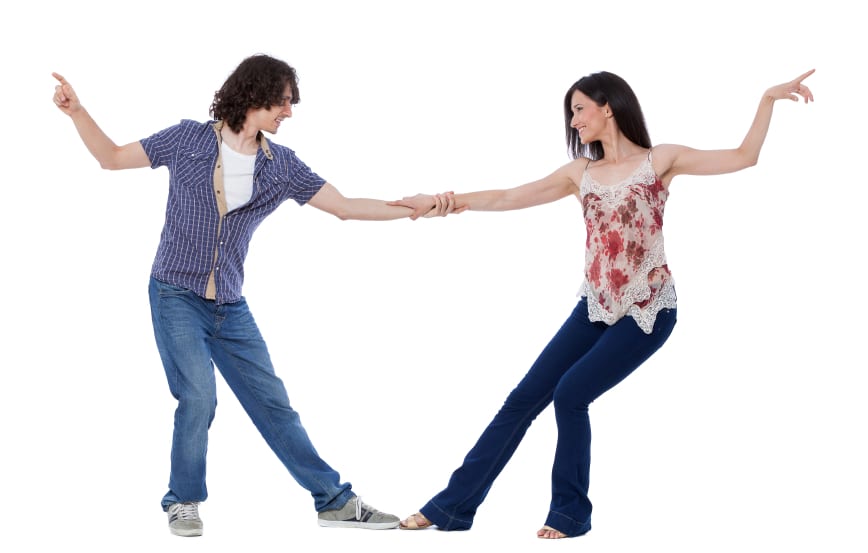 man and woman dancing together against a white background