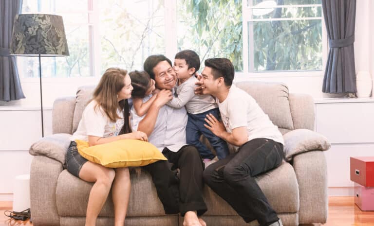 happy family sitting on a couch