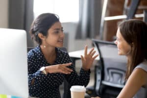 two females having a friendly conversation