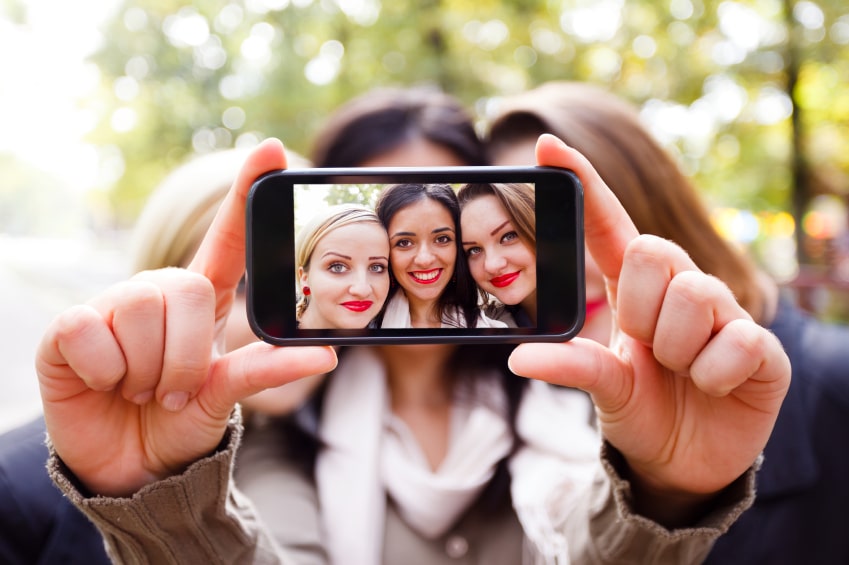 three women taking a selfie