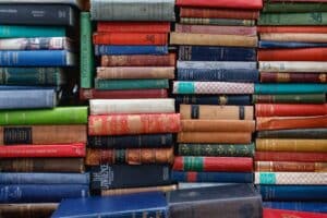 Stacks of books on a bookshelf