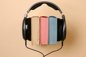 headphones wearing a stack of books