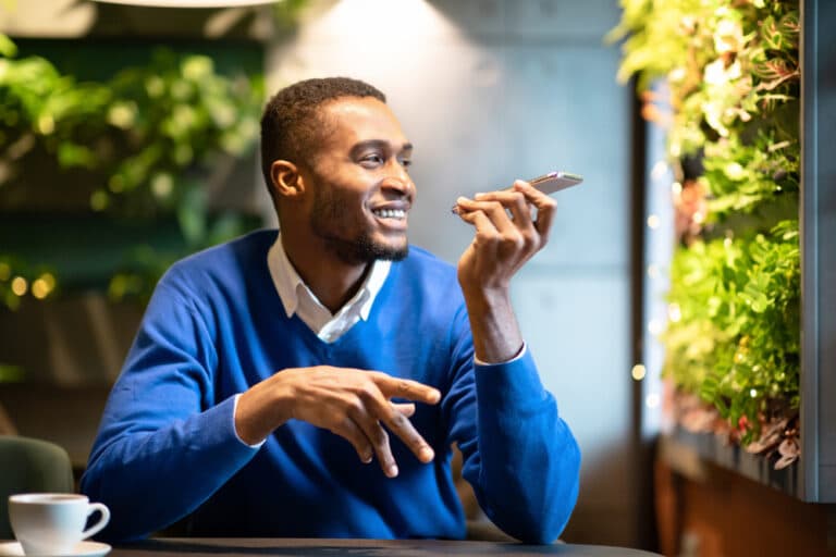 man using a speech recognition language learning app on his phone