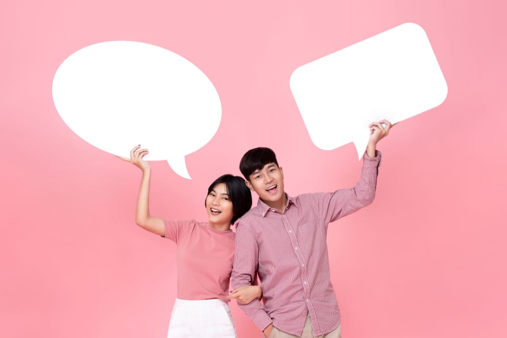 asians holding speech bubbles