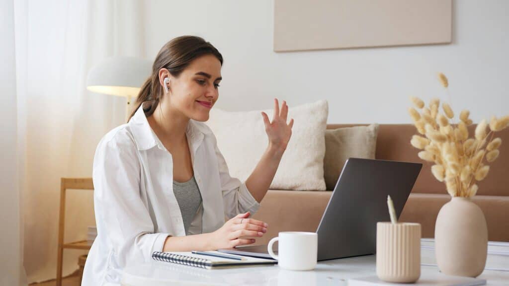 young-woman-waving-on-video-call