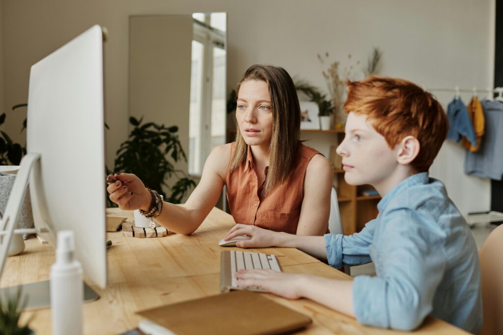 Photo by Julia M Cameron: https://www.pexels.com/photo/photo-of-woman-tutoring-young-boy-4145354/