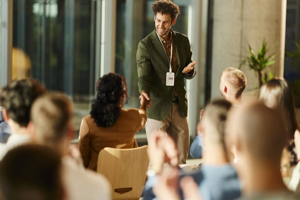 public-speaker-shaking-hands-with-audience-member