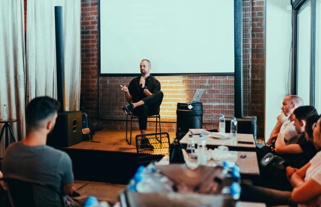 man-speaking-in-front-of-audience