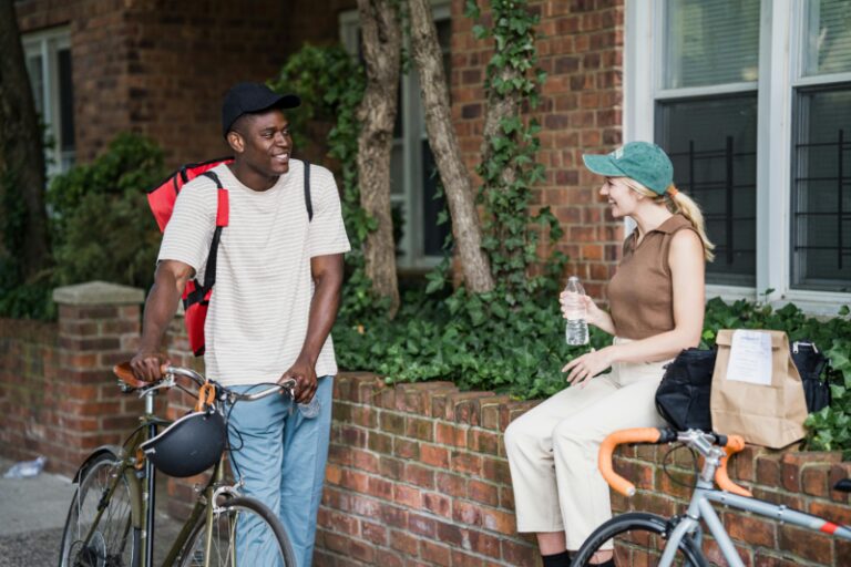 Photo by Mizuno K: https://www.pexels.com/photo/smiling-people-with-bikes-talking-outdoors-13431931/