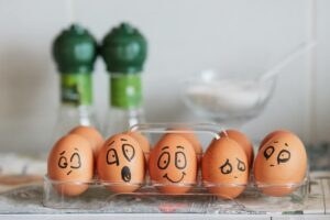 eggs with faces emotions drawn on