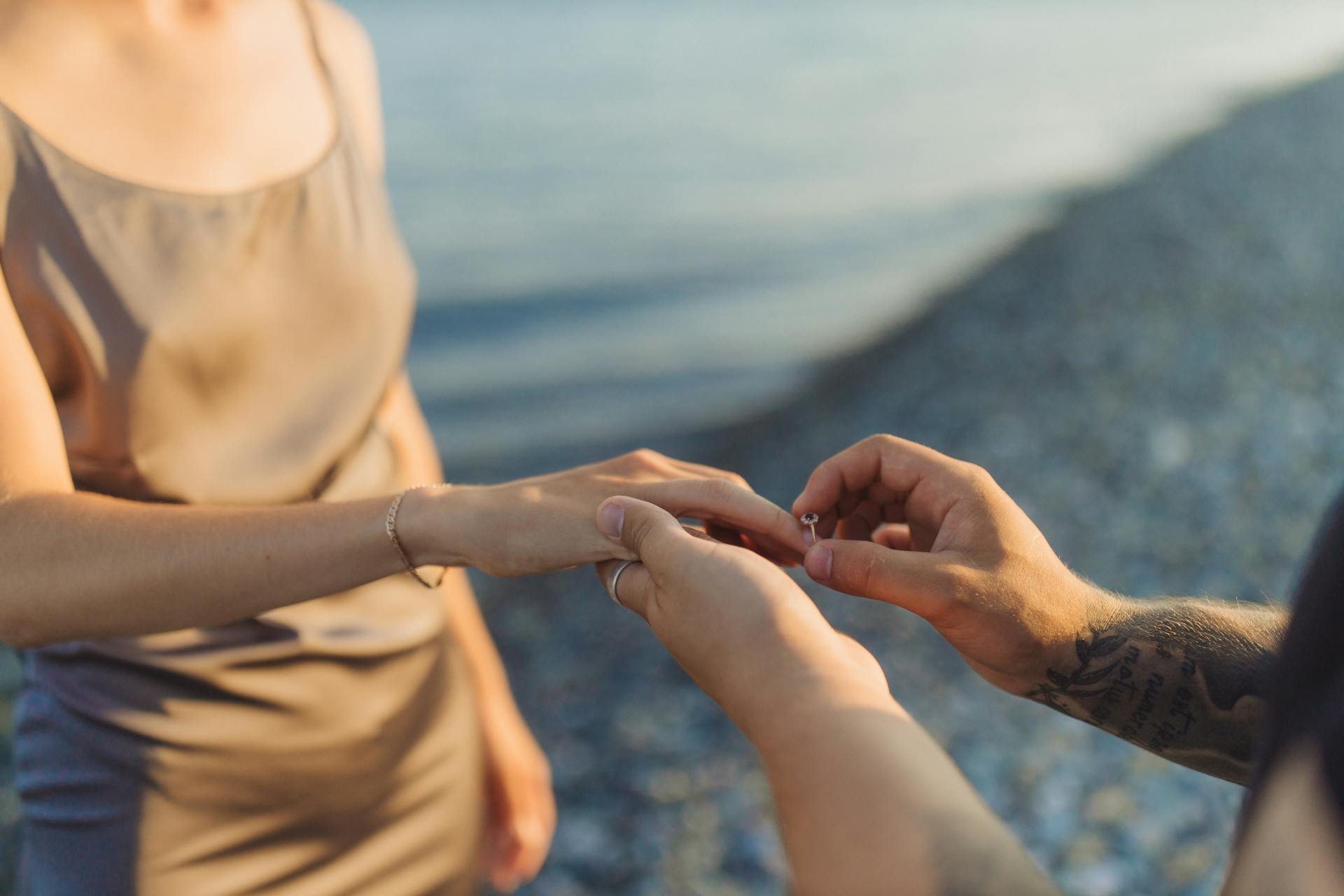 man-putting-ring-on-womans-finger