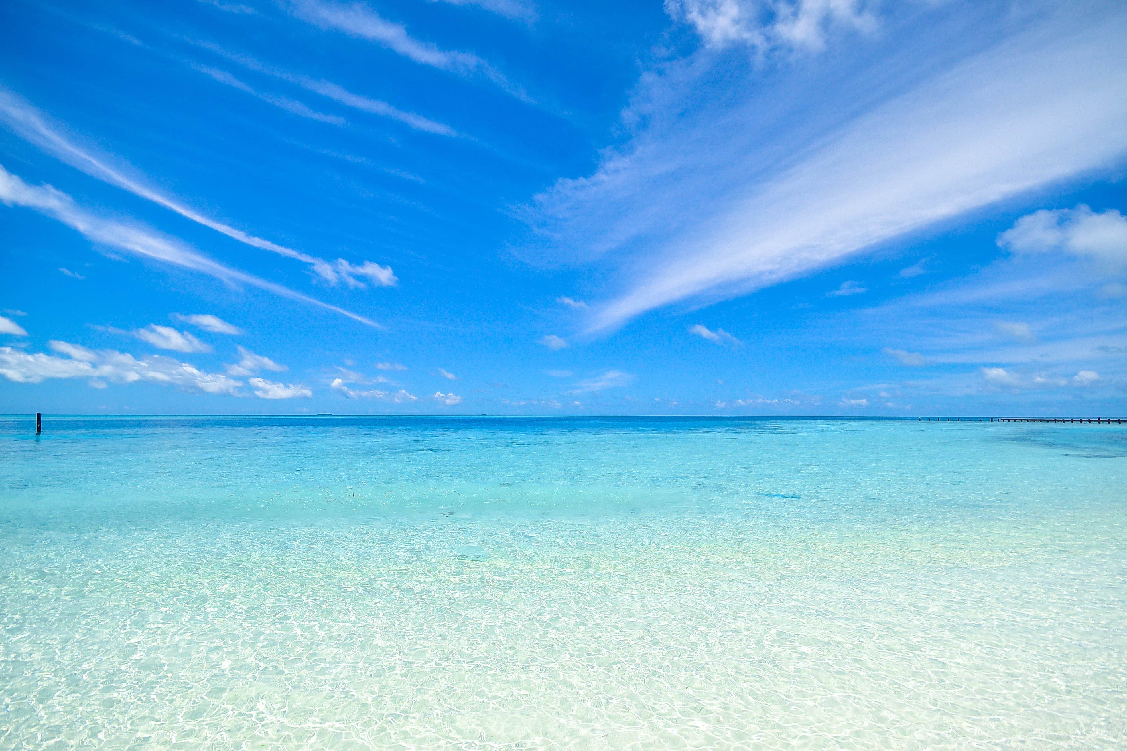 A clear summer day over a turquoise sea