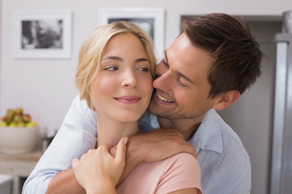 couple cuddling and looking lovingly at each other