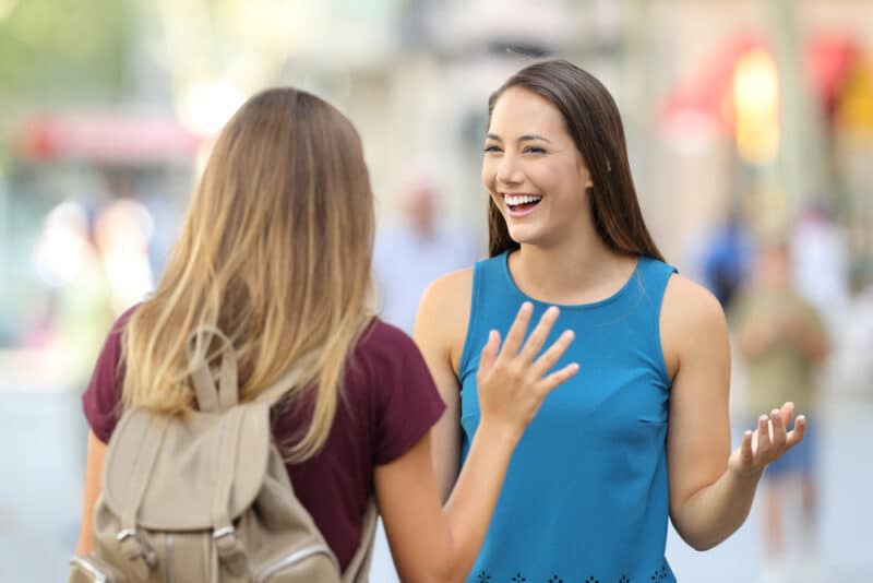 two-women-greeting-each-other