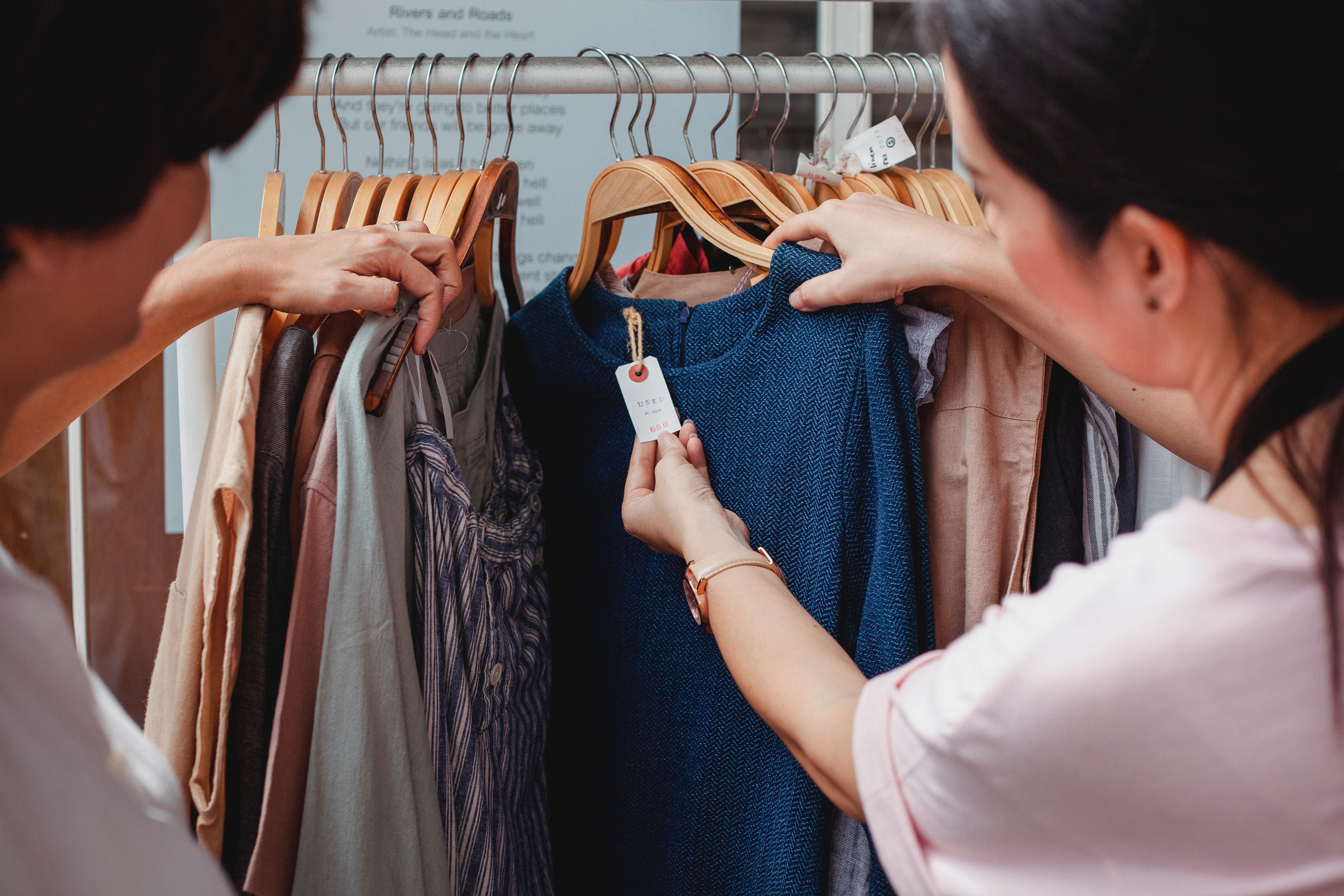 two-people-shopping-for-clothes