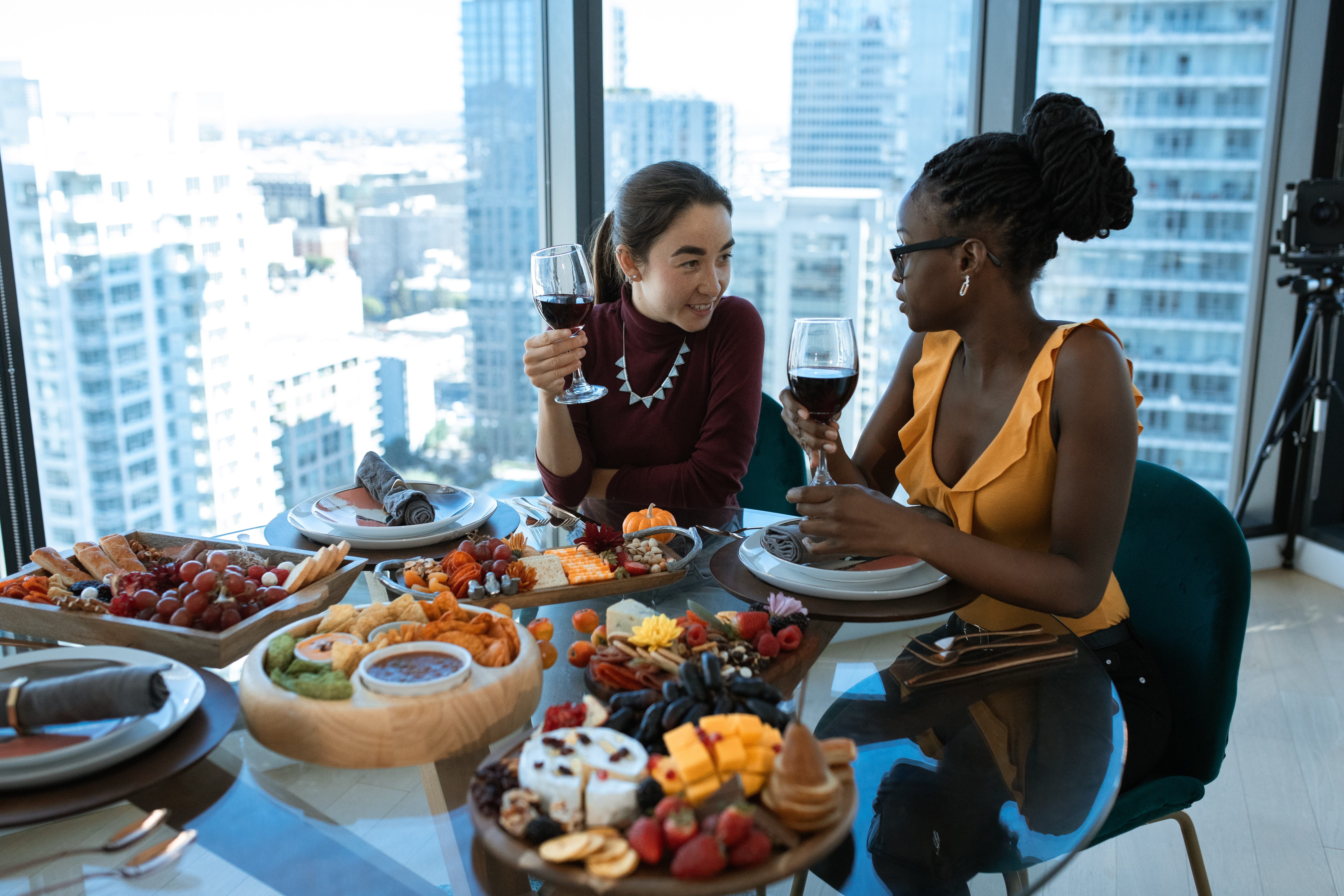 two-women-eating-and-drinking-at-restaurant