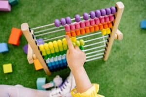 child counting on an abacus