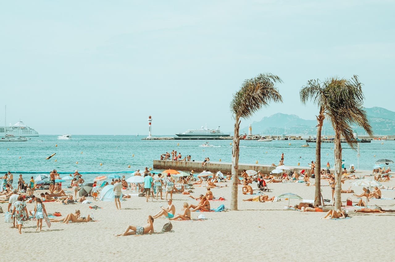 People relaxing on the beach in the summer