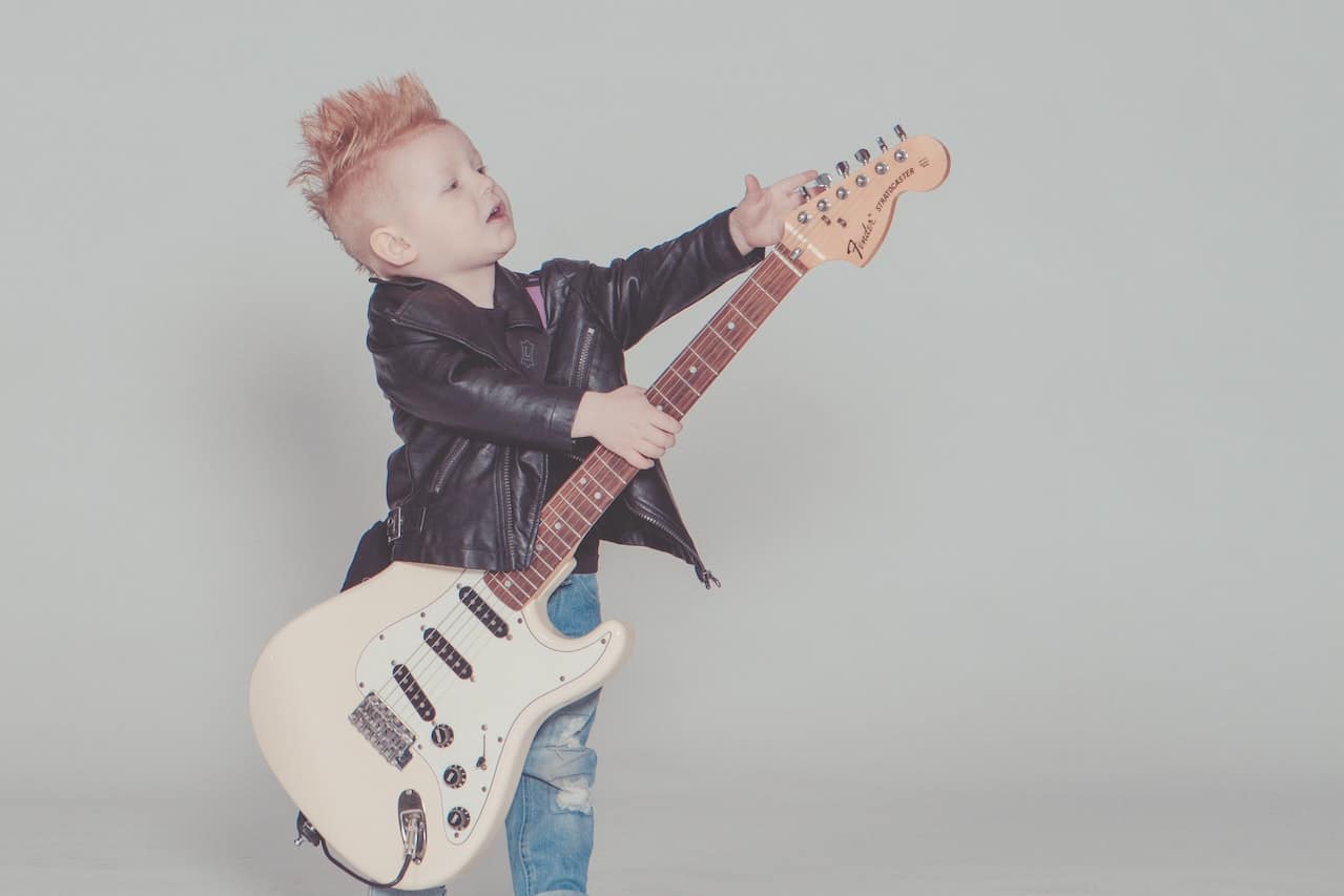 rock kid playing guitar
