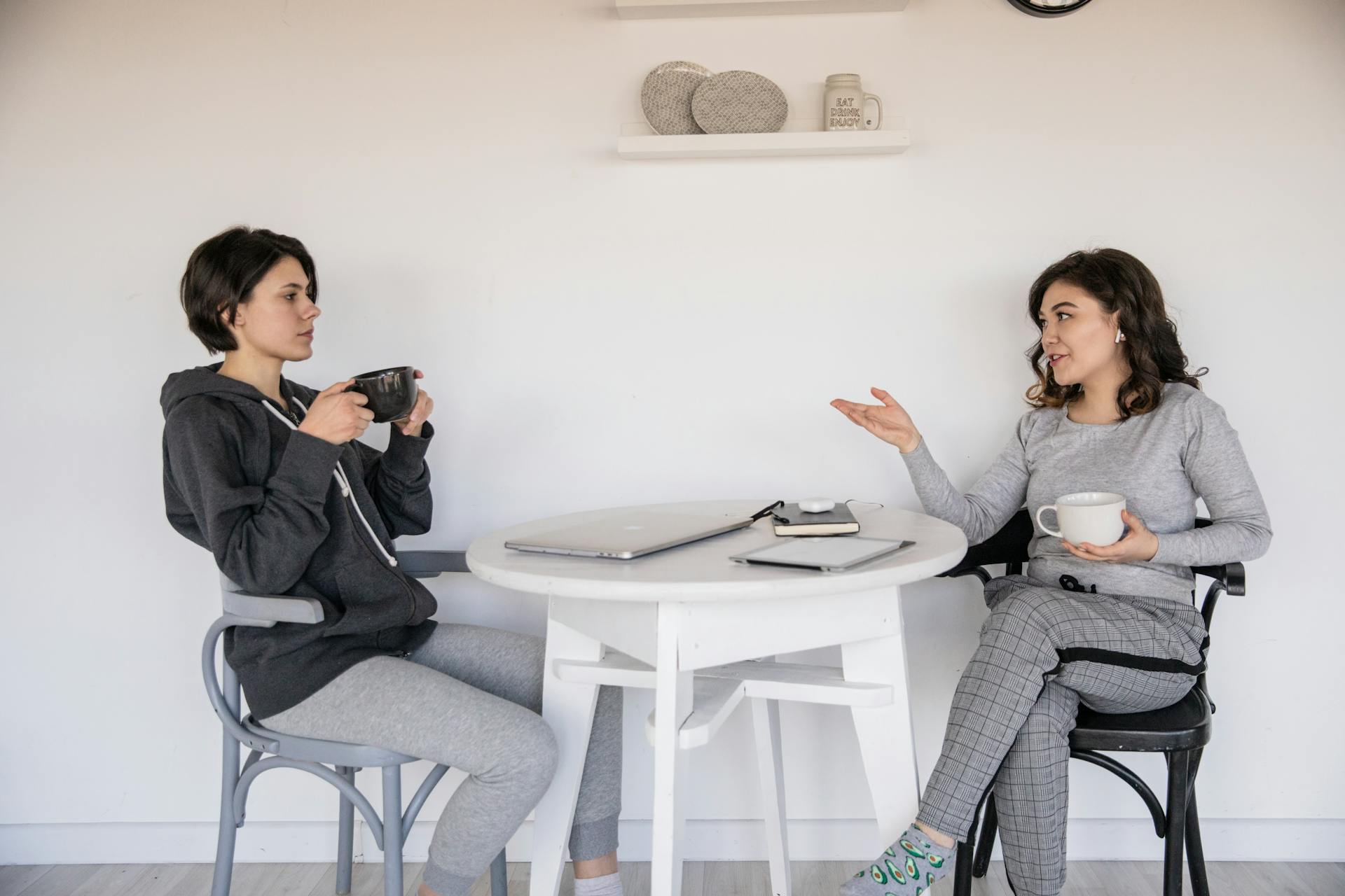 two-women-chatting-with-each-other-over-coffee