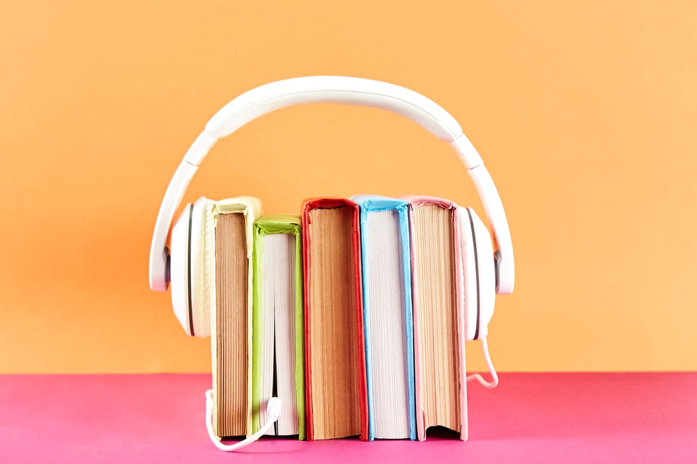 headphones around paper books