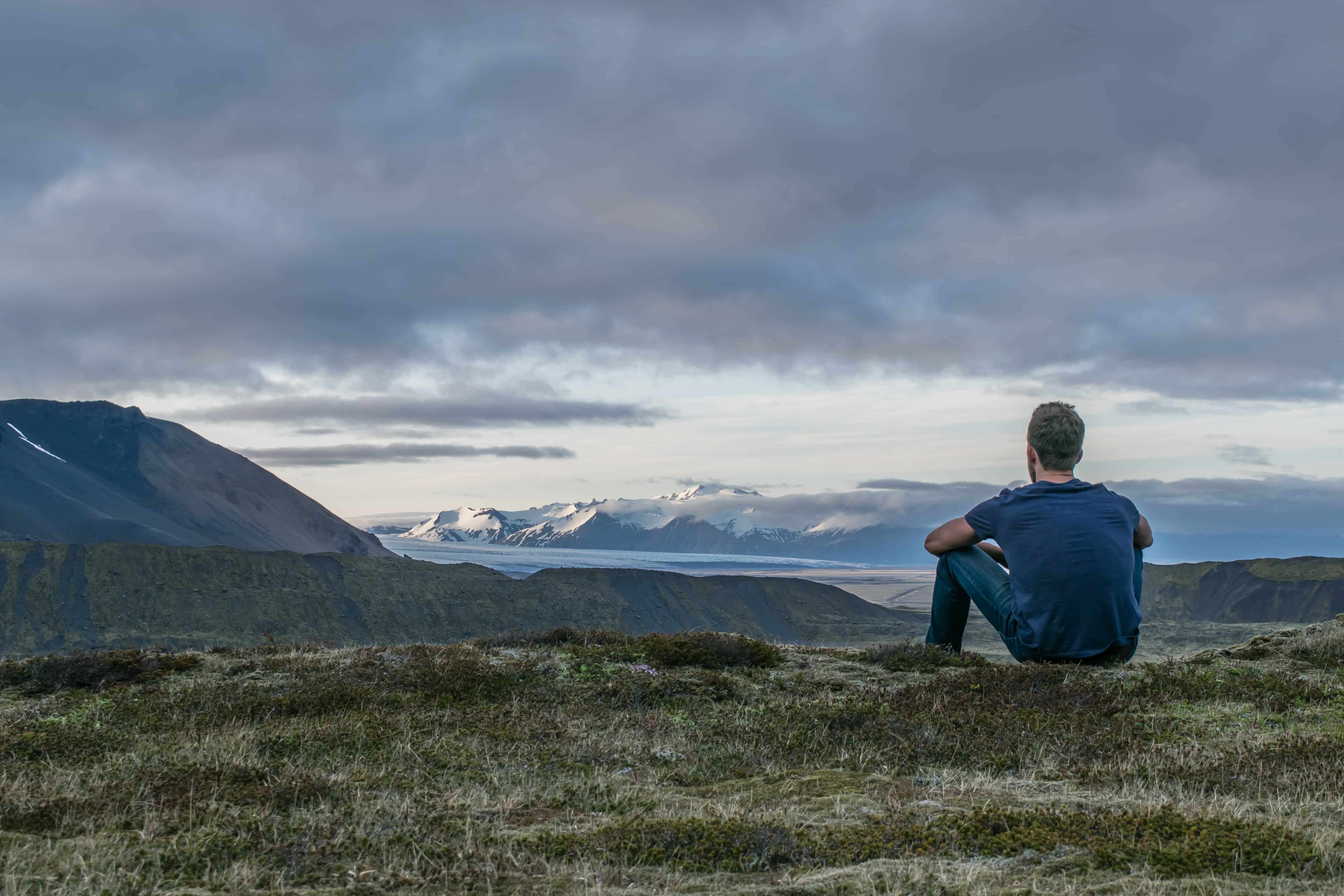 A man pondering a natural scene