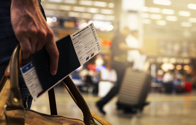 man-with-boarding-pass-at-airport