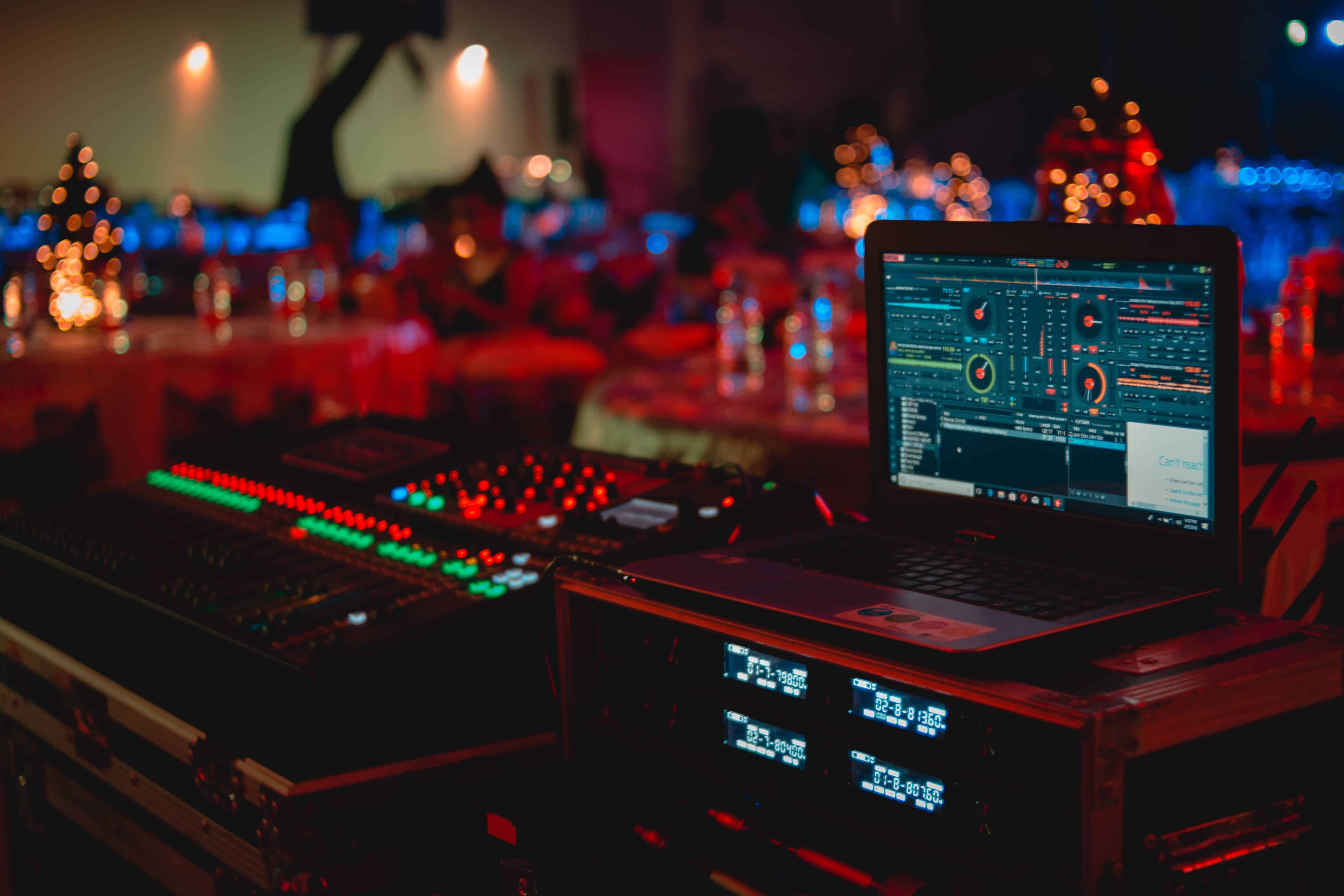 An illuminated computer set up on a desk