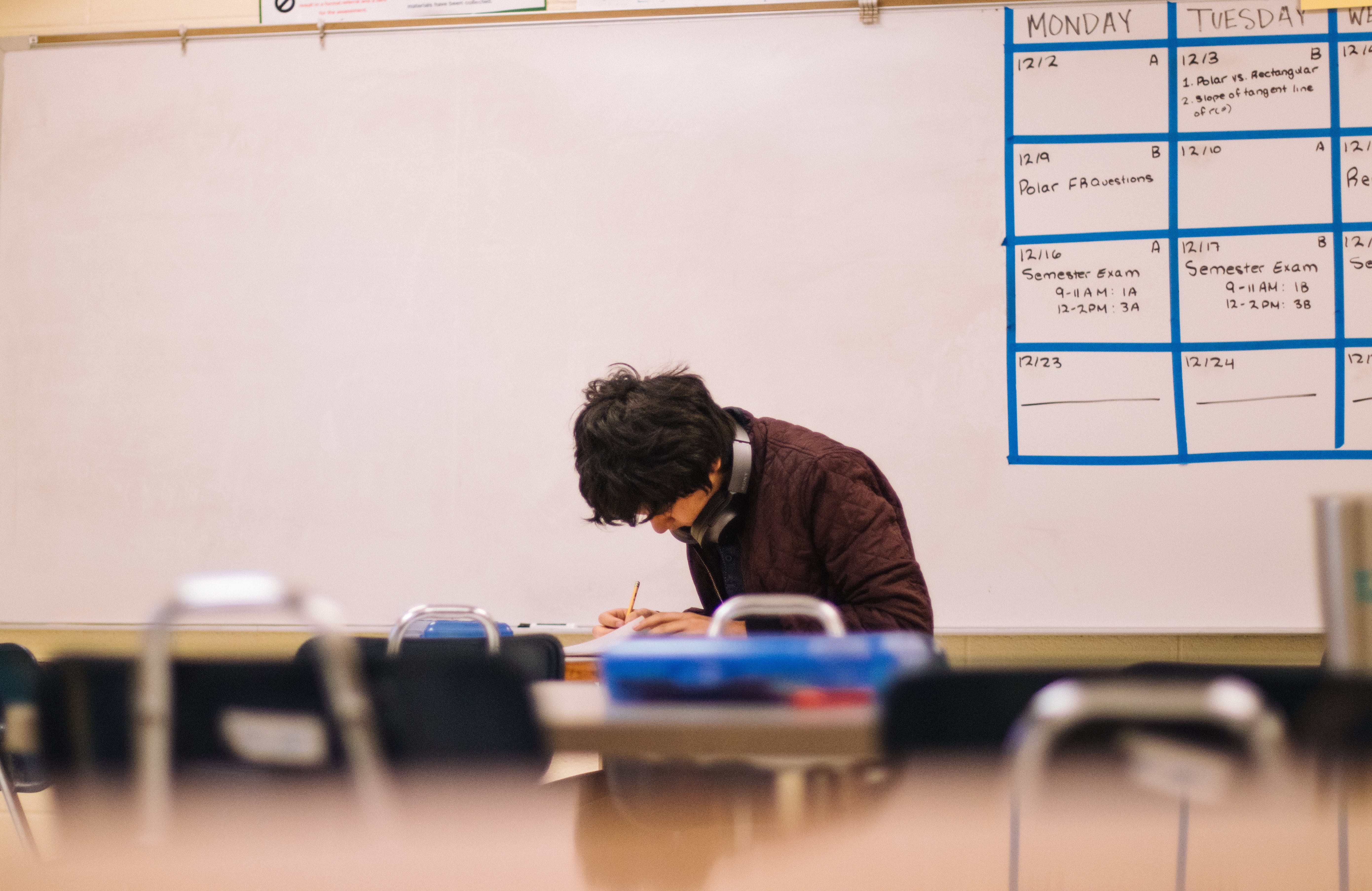 A man taking an examination in a classroom