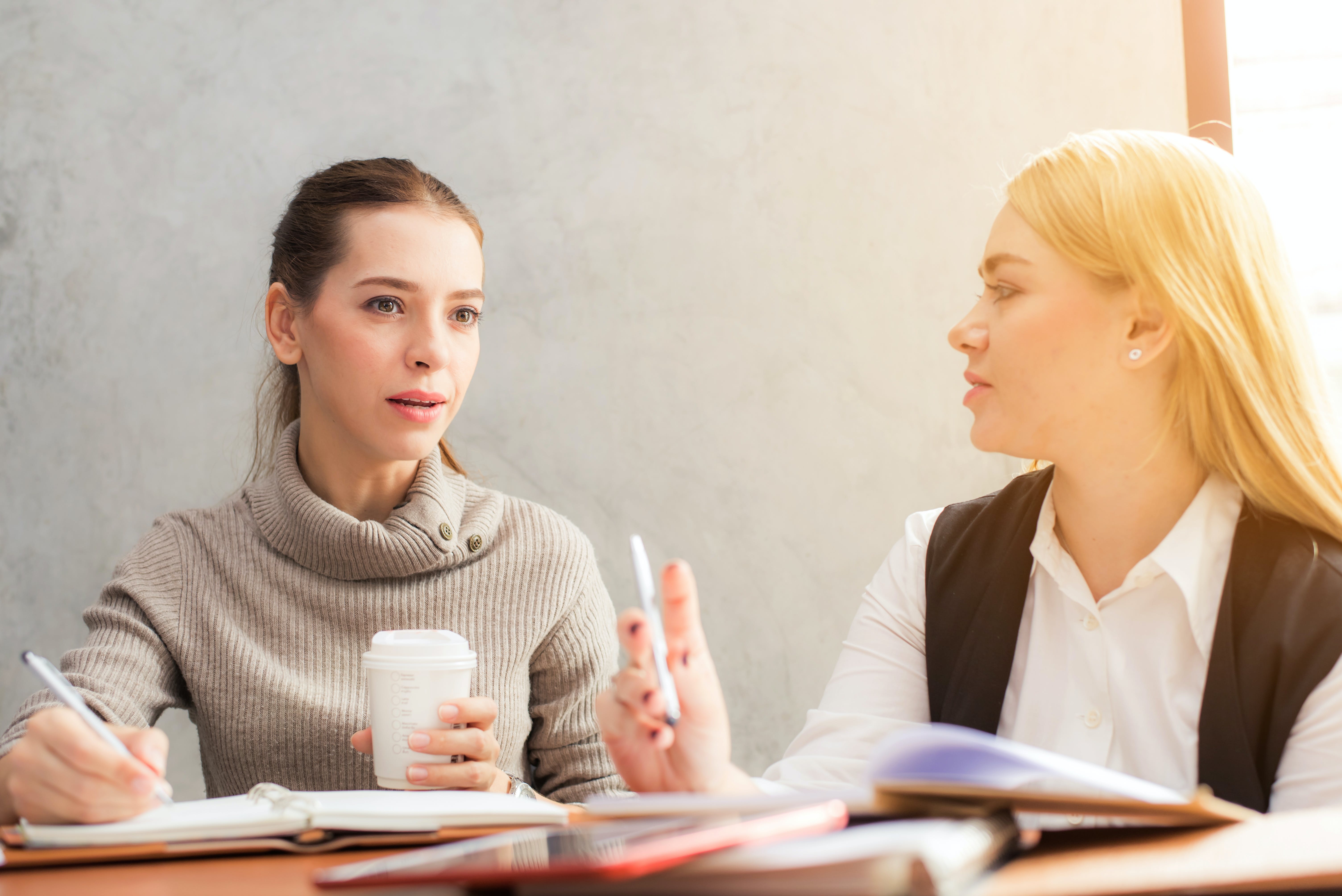 Two women doing a language exchange