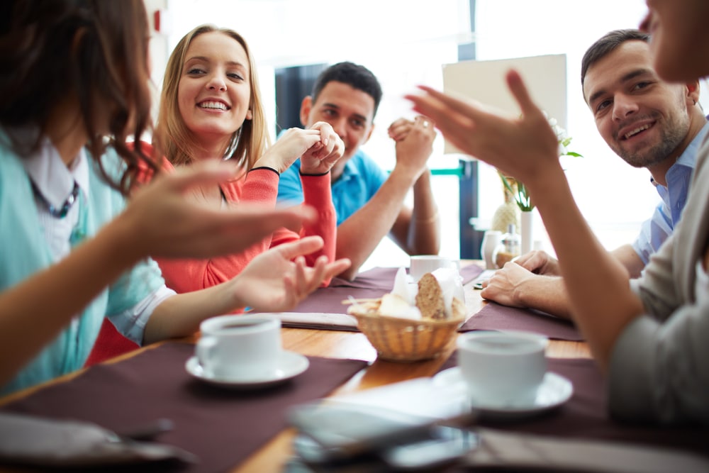 teenage friends hanging out in a cafe